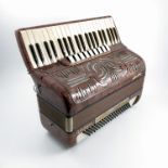 An Ariston Castelfidardo piano accordion, in a mar