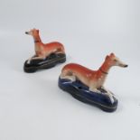 A pair of 19th century Staffordshire pen holders,