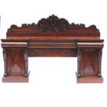 A 19th century mahogany pedestal breakfront sidebo