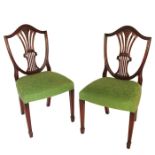 A set of 8 Hepplewhite style shield back mahogany dining chairs