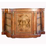 A Victorian burr walnut credenza, having a panelled door with two glazed side doors, with box wood