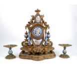A 19th century gilt metal and porcelain mantle clock, with Sevres style blue panels, the interior