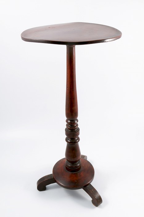 A mahogany occasional table, the circular top raised on a turned column to circular base and three