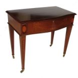 An Edwardian mahogany serpentine canteen table, with rising lid and inlaid paterae to the square