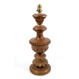 A pair of bleached turned wooden candlesticks, height 19.5ins, together with a turned wooden