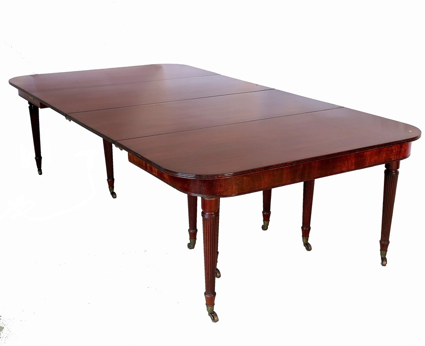 A Regency mahogany extending dining table, in the manner of Gillows, raised on ten reeded tapering - Image 2 of 4