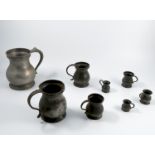 Eight graduated pewter measure, of various ages, of baluster form with handles