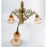 An antique continental rococo style three branch brass chandelier, with down-swept arms, and