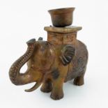 A metal model, of an Indian elephant with howda candle holder, height 8.5ins