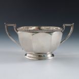 A silver faceted two handled sugar bowl, having a gadrooned rim, Sheffield 1931, weight 6oz