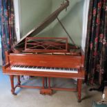 A satinwood grand piano by Perzina, raised on leaf and reeded column legs, the frame stamped 2149