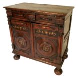 A late 17th century design oak and bog oak cabinet, with moulded drawer formed as two short drawers,