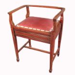 A mahogany piano stool, with boxwood line inlay, raised on square tapering legs united by