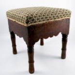 An oak square stool, with needle work stuff over seat, raised on turned legs, 15ins square