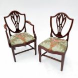 A set of eight mahogany dining chairs, with shield backs and pierced splats