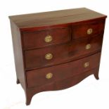 A Regency mahogany bow front chest, of two short over two long drawers, raised on bracket feet,