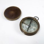 A circular metal cased compass, with engraved silvered dial, marked Made in France, diameter 2.