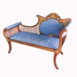 An Edwardian two seat sofa, with bone and boxwood inlay of scrolls and acanthus, with spindle end