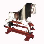 A modern child's rocking horse, with swing action, raised on turned columns and H form base,  height