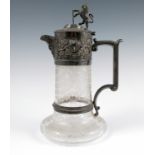 An Elkingtons silver plated and glass claret jug, the glass body engraved with leaves, the silver