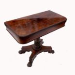 A 19th century rosewood card table, raised on a turned column to a platform base, terminating in