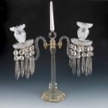 A glass two branch table lustre, with central oblique and two branches with candle holders and