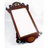 A Georgian fret cut wall mirror, with hoho bird and paterae, overall height 36ins, overall width