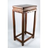 An Oriental hardwood stand, of rectangular form, 15ins x 11ins x 30.5ins