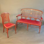 An Edwardian mahogany salon suite, comprising a sofa, width 46ins, and four chairs with wavy spindle