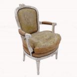 An 18th century Louis XVI painted walnut fauteuil, with carved bows to front and crest rail and