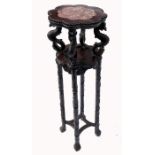 An Eastern design hardwood jardiniere stand, having marble top supported by stylised serpents,