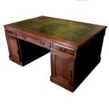 A Georgian style mahogany partners desk, fitted frieze drawer to each side, flanked on one side by