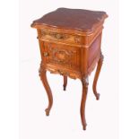 A continental bedside cabinet, with serpentine shaped marble top, carved panel door, raised on