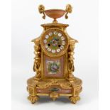 A 19th century French gilt metal and porcelain mantel clock, the striking movement stamped P.Ltre,