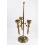 A brass three light candle stand, the central pole with three branches containing removable candle