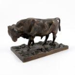 A bronze model, of a bull, standing on a rectangular base decorated with leaves, height 3.25ins