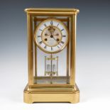A Le Roy & Fils brass four glass mantel clock, with visible escapement, Roman numerals and mercury