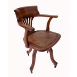 An office chair, with pierced splat back, raised on four outswept legs, height 33ins