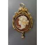 A Victorian Shell Cameo and Pearl Pendant decorated with the bust of a classical maiden, c. 42mm