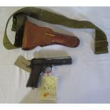 A Colt .45 Semi Automatic Pistol, serial no. C17077, with leather holster and belt