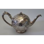 A Georgian Silver Teapot with embossed foliate scroll decoration, London 1801, Peter, Ann &