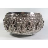 A Large Asian Silver Bowl with repoussé decorated scenes of dancers, engraved mark to base, 892g, 25
