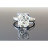 An 18ct White Gold 5.26ct Diamond Solitaire. The radiant cut stone estimated SI2/I1 J/K, size M, 6.