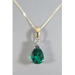A 9K White and Yellow Gold Diopside and Diamond Pendant, 1.8 cm drop and on 9ct chain, 1.6g