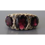 A 9ct Gold Garnet and Diamond Dress Ring, size P, 4.3 g