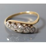 A Gold Five Stone Diamond Twist Ring, size O.5, 2.5 g