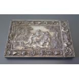 An Elkington Electrotype Card Case decorated with a central reserve of putti and ram in a foliate