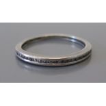 A .1ct Diamond Half Eternity Ring in precious white metal setting, size J.5, 2.1g