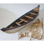 A Hand Built Wood and Canvas Boat, 68 cm long