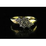 An 18ct Gold and Diamond Ring, size M, 4g